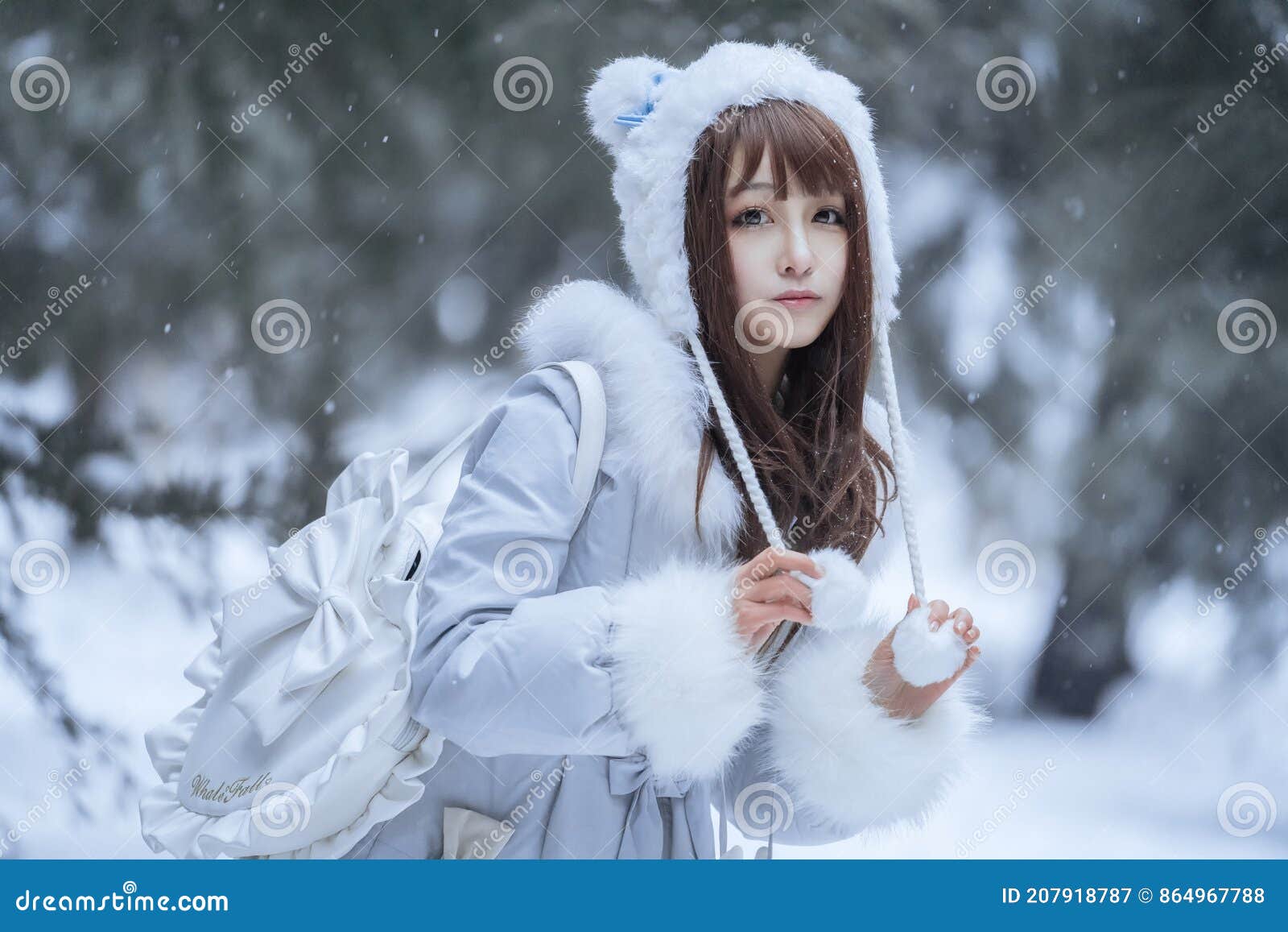 the beautiful maiden in the snow in winter